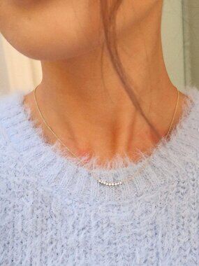 Cupcakes & Cashmere Dipsea Gold Diamond Curve Necklace